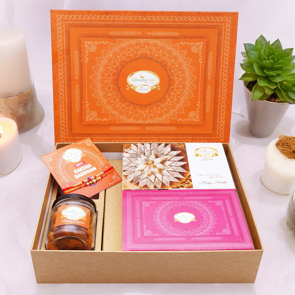 Ghasitaram Orange Hamper Box with Kaju Katli ,  Milk Cake, 2 Rakhis, Card, and Mixed Dryfruit Jar