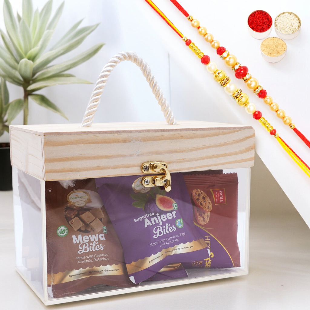 Wooden Acrylic Box of Mewa Bites, Sugarfree Bites and Cookies Pouches with 2 Rakhis