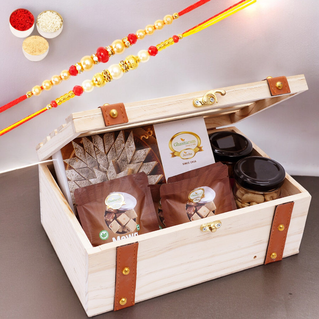 Wooden Leather Belt Box of Kaju Katli, 2 jars of Cashews and Almonds and 5 Mewa Bites with 2 Rakhis