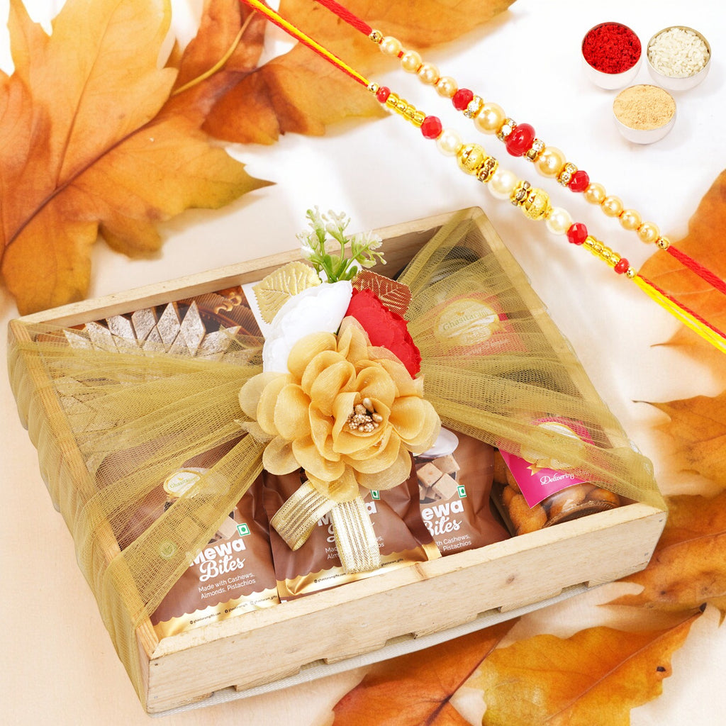 Wooden tray of Kaju Katli, 5 Mewa Bites and 2 Jars of Paan Raisins and Crunchy Cashews with 2 Rakhis