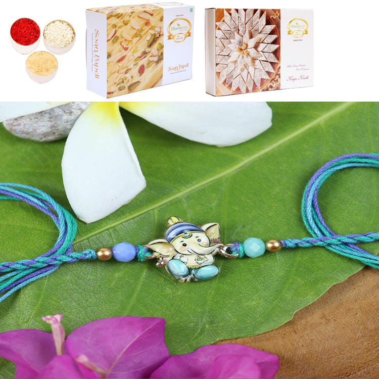 ST24-130- Printed Stone Ganpati Divine Rakhi with 200 gms of Kaju katli and 200 gms of Soan Papdi