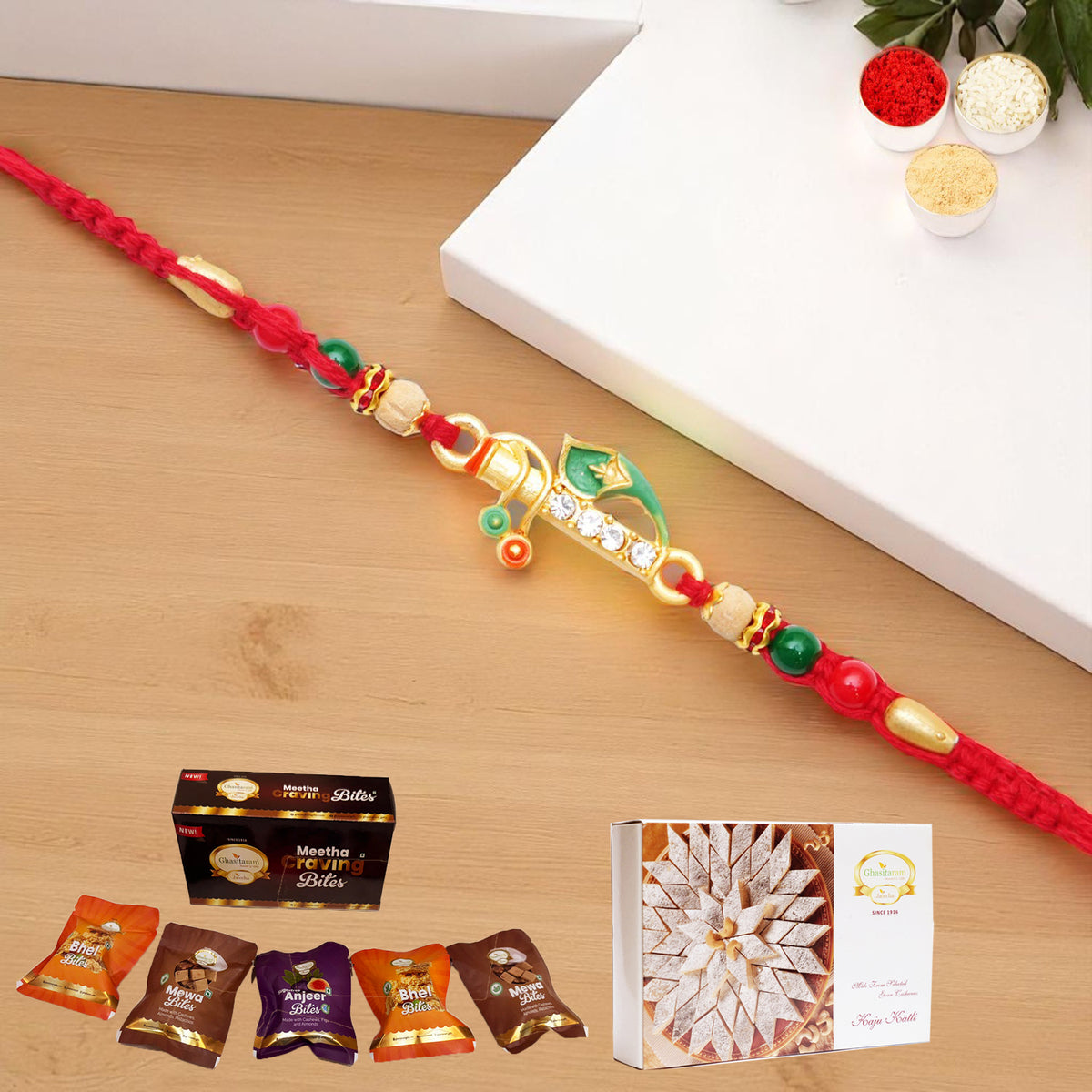 x-73 Divine Krishna Rakhi with Asorted bites box and 200 gms of Kaju katli