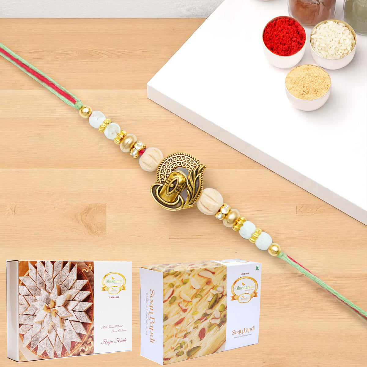 X-87 Om Shiv Divine Rakhi with 200 gms of Kaju katli and 200 gms of Soan Papdi