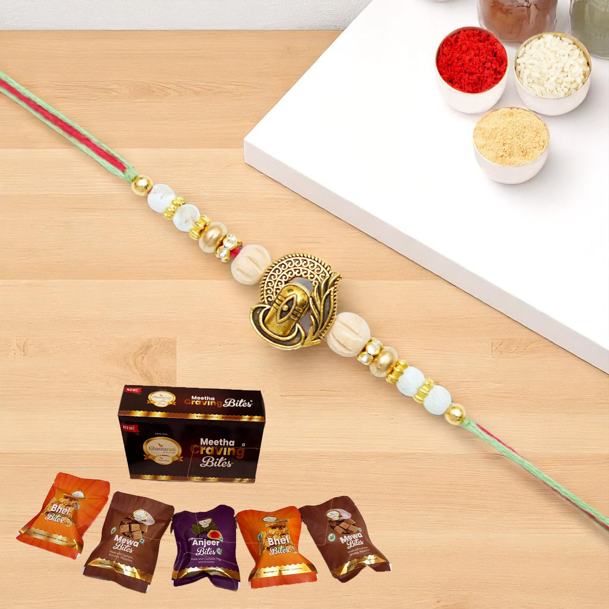 X-87 Om Shiv Divine Rakhi with Asorted bites box