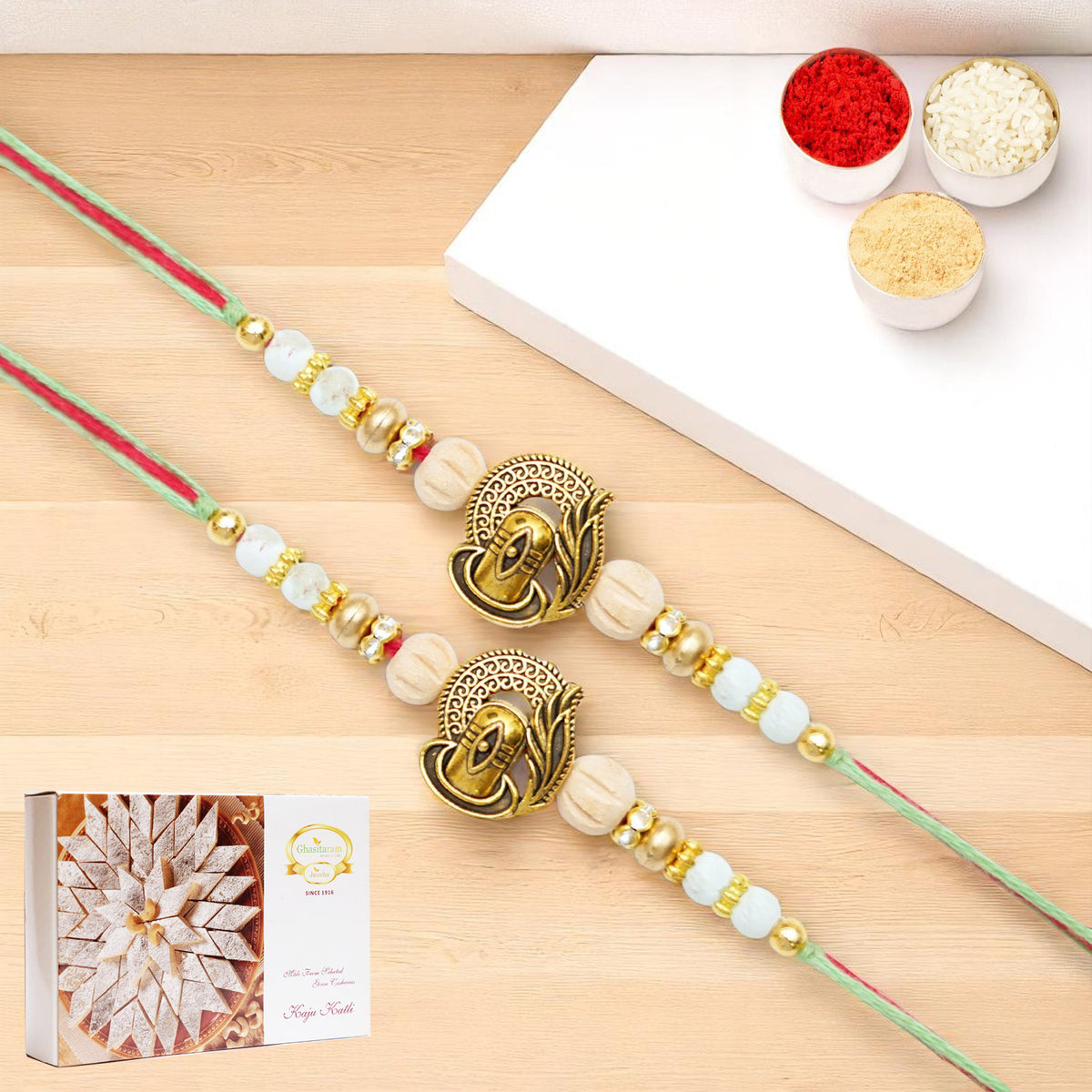 Rakhis Online USA-Set of 2 - X-87 Om Shiv Divine Rakhi with 200 gms of Kaju katli