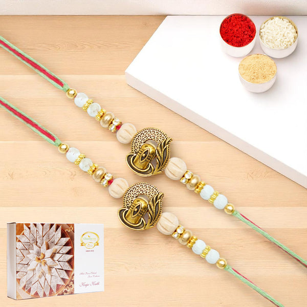 Rakhis Online USA-Set of 2 - X-87 Om Shiv Divine Rakhi with 200 gms of Kaju katli