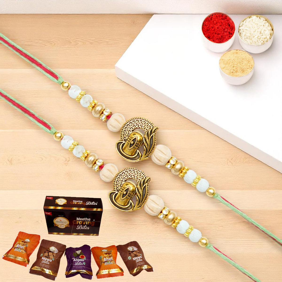 Rakhis Online USA-Set of 2 - X-87 Om Shiv Divine Rakhi with Asorted bites box
