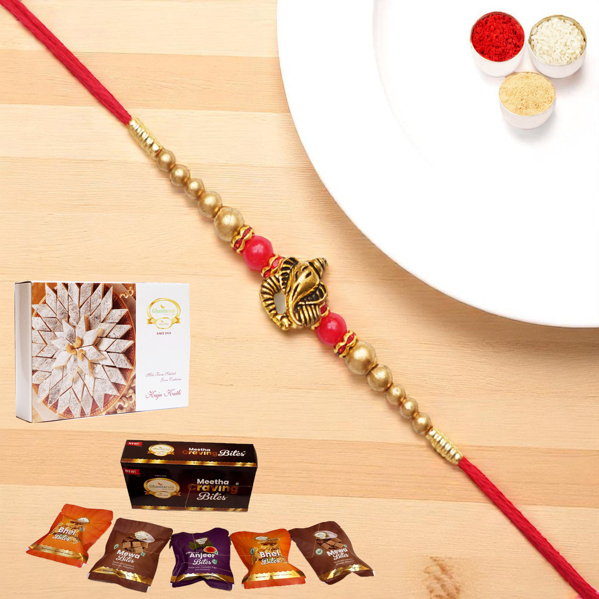 Y-26 Ganesha divine Rakhi with Asorted bites box and 200 gms of Kaju katli