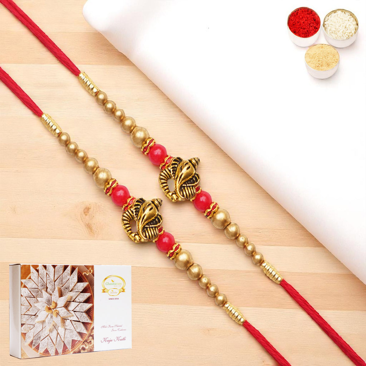 Rakhis Online UK-Set of 2 - Y-26 Ganesha divine Rakhi with 200 gms of Kaju katli