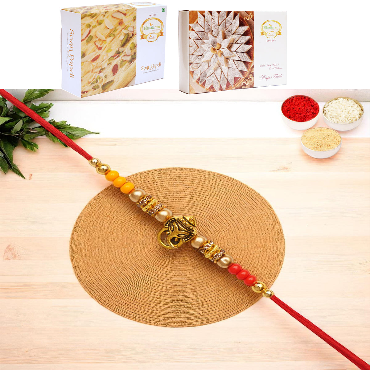 Y-58 Ganesha divine Rakhi with 200 gms of Kaju katli and 200 gms of Soan Papdi