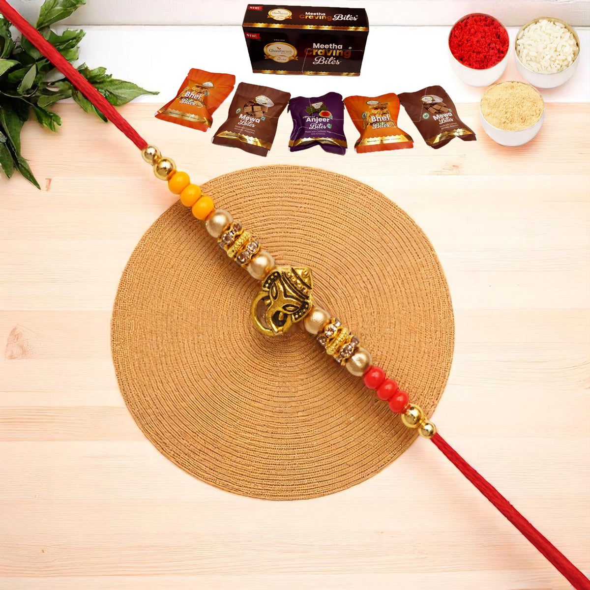 Y-58 Ganesha divine Rakhi with Asorted bites box