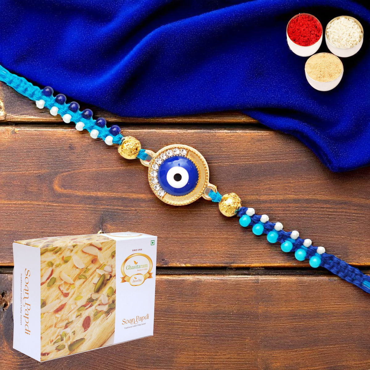 X-134 evil Eye Fancy Rakhi with 400 gms of Soan Papdi