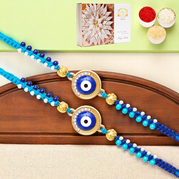 Rakhis Online USA-Set of 2 - X-134 evil Eye Fancy Rakhi with 200 gms of Kaju katli