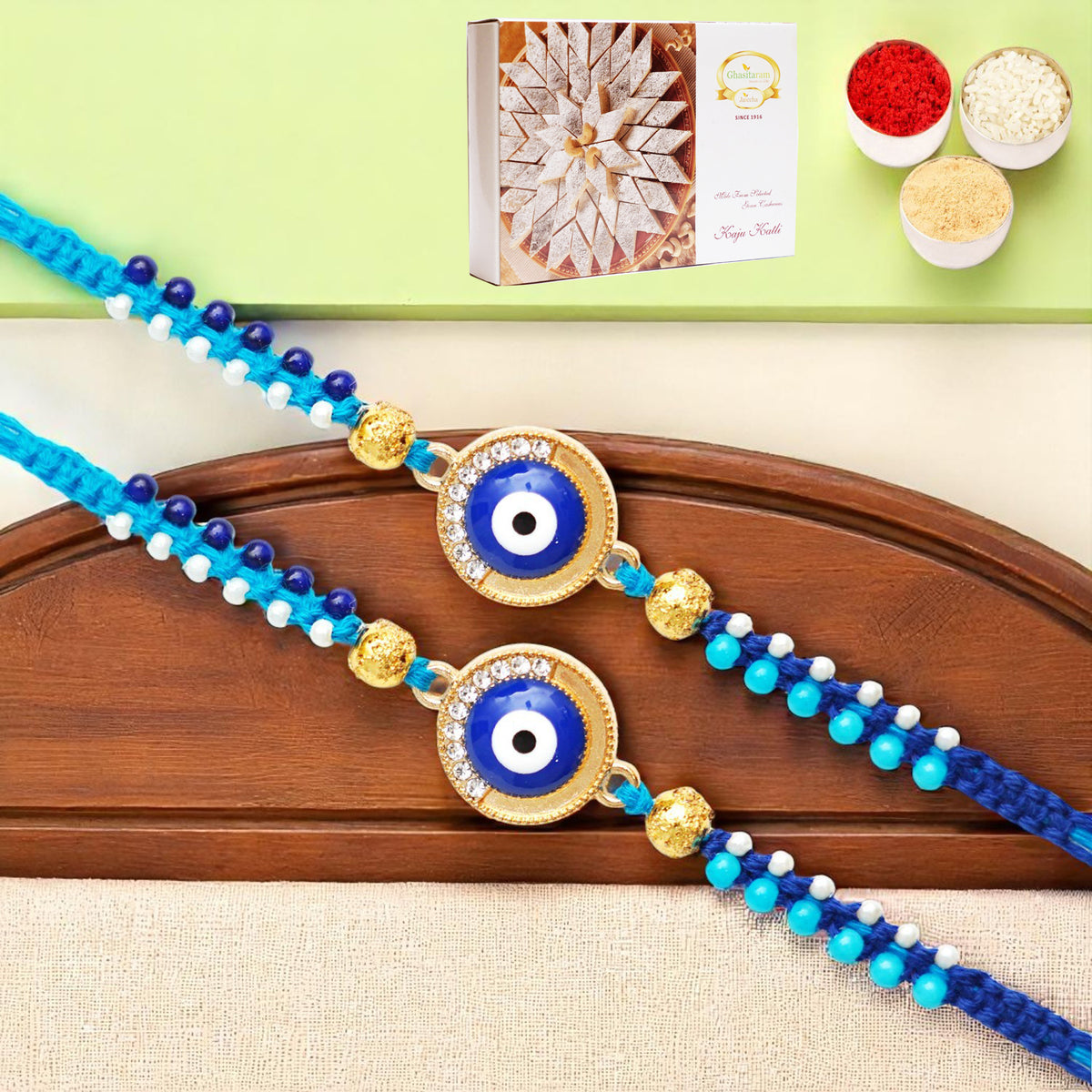 Rakhis Online UK-Set of 2 - X-134 evil Eye Fancy Rakhi with 200 gms of Kaju katli