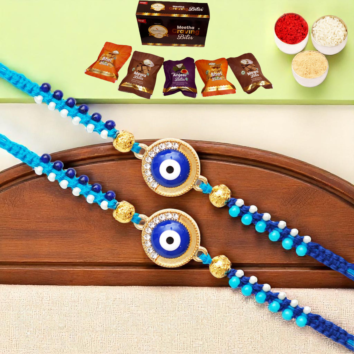 Rakhis Online USA-Set of 2 - X-134 evil Eye Fancy Rakhi with Asorted bites box
