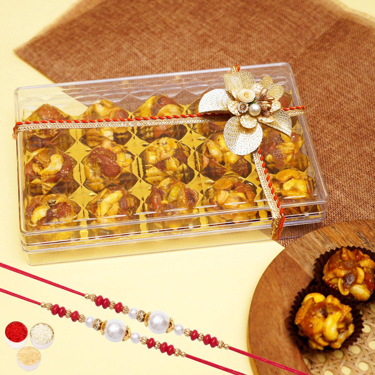 Rakhi Gift-Dryfruit Laddoos in Acrylic Box with 2 rakhis