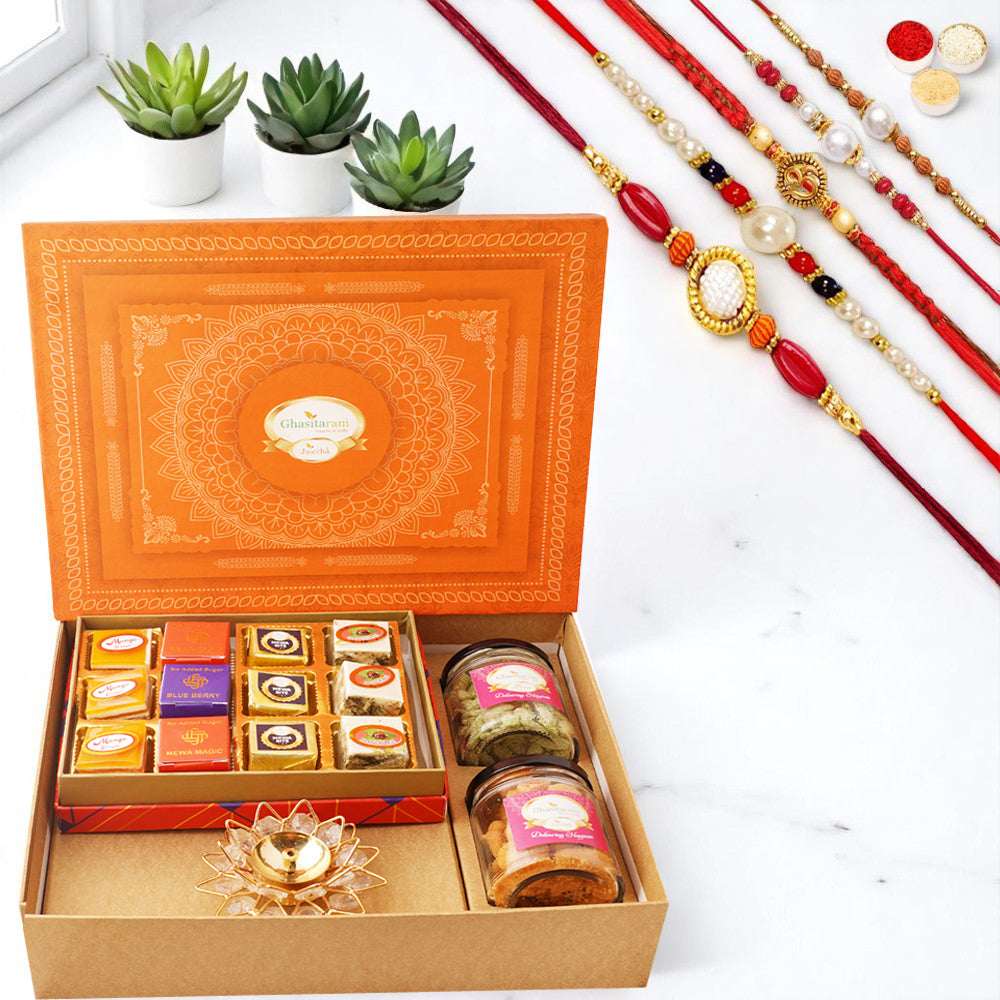 Orange Hamper box with best bites, crunchy cashew, Flavour raisins, and diya with 5 rakhis
