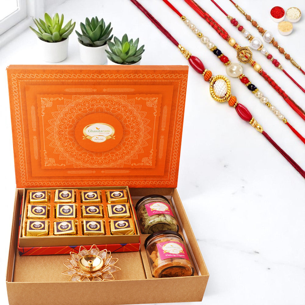 Orange Hamper box with best bites, crunchy cashew, Flavour raisins, and diya with 5 rakhis