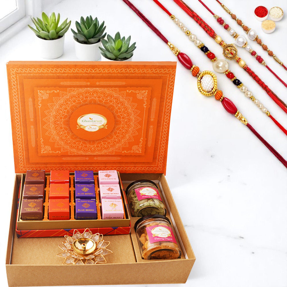 Orange Hamper box with best bites, crunchy cashew, Flavour raisins, and diya with 5 rakhis