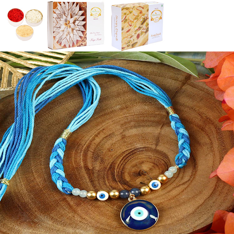 ST25-009-Evil Eye With Thread Weave Design Premium Rakhi  with 200 gms of Kaju katli and 200 gms of Soan Papdi