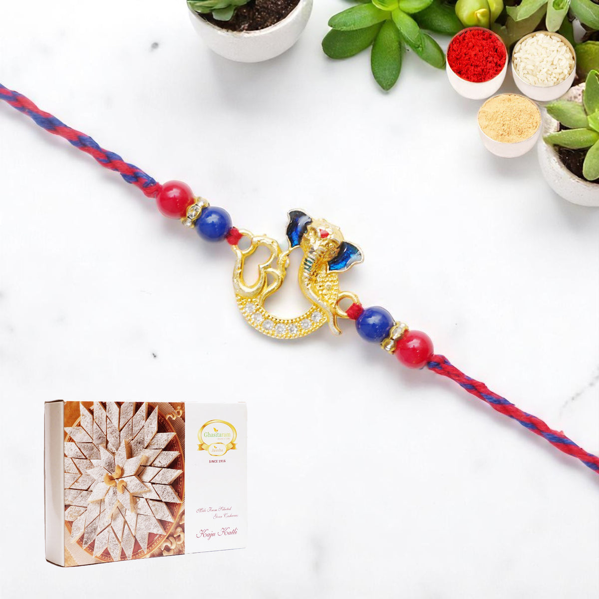 Rakhis Online USA-Om Ganesha Premium Rakhi- K-47 with 200 gms of Kaju katli