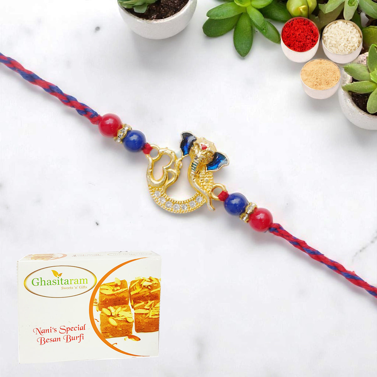 Rakhis Online UK-Om Ganesha Premium Rakhi- K-47 with 200 gms of Besan Barfi