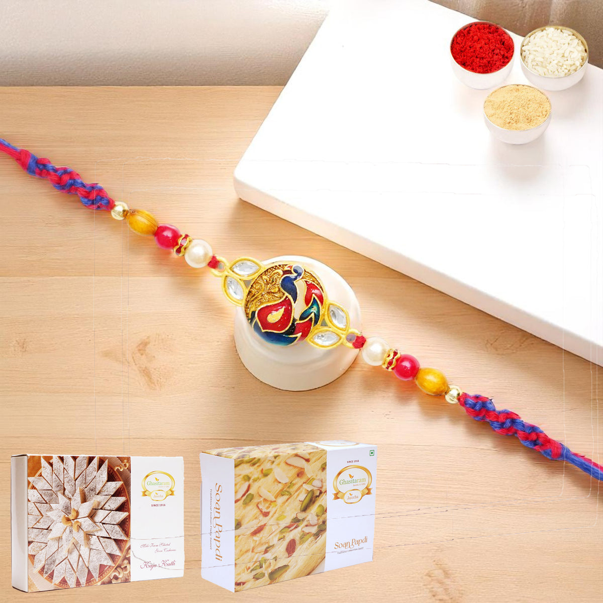 K-73 Premium Rakhi with 200 gms of Kaju katli and 200 gms of Soan Papdi
