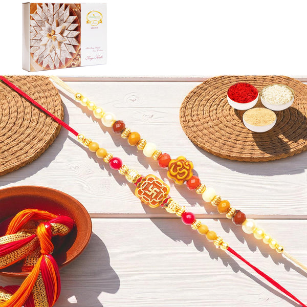 Rakhis Online USA-Set of 2 abc35 and abc105 om rakhis with 200 gms of Kaju katli