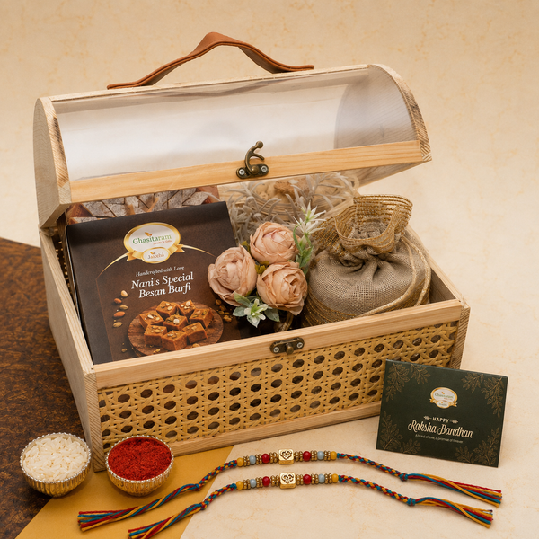 Rattan Trunk Box of Kaju Katli, Besan Barfi, Namkeen and Dryfruit with 2 Om Premium Rakhis