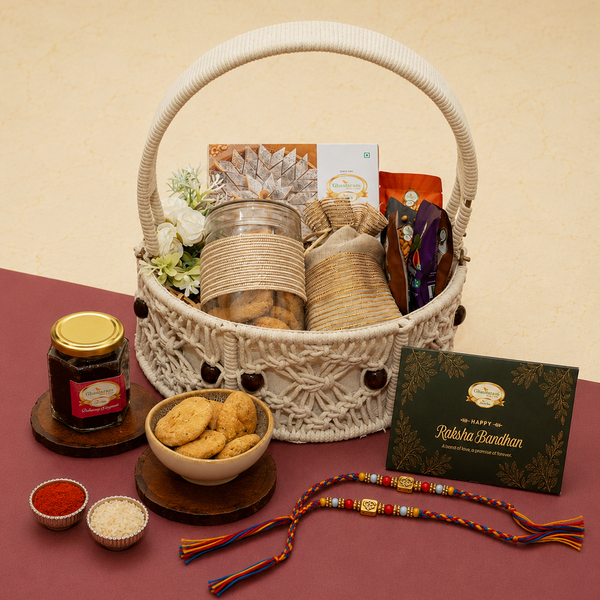 Round Macrame Basket of Kaju Katlis, Namkeens, Mithai/Sweet pouches and Fudge with 2 Premium Om rakhis
