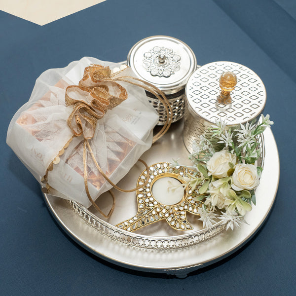 Silver round Tray of Kaju Katli/ Mithai/ Sweet Pouches and Dryfruit