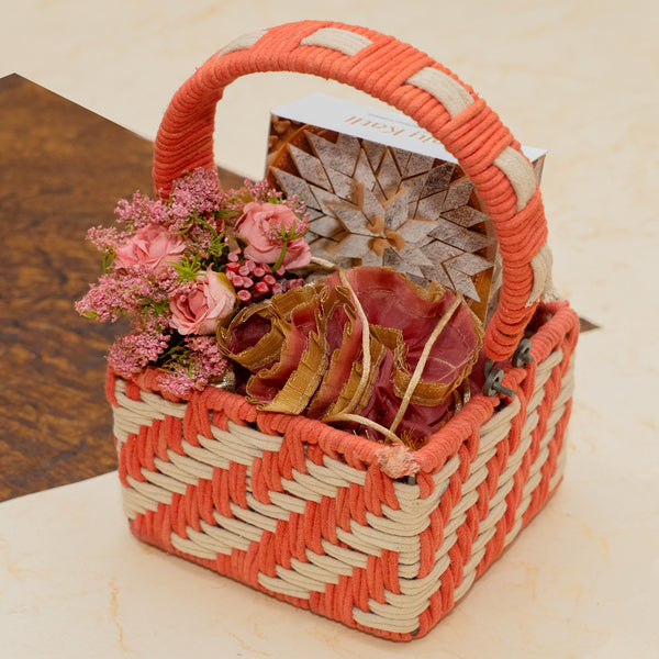 Small Red Rope basket of kaju Katlis and Chocolate Almonds