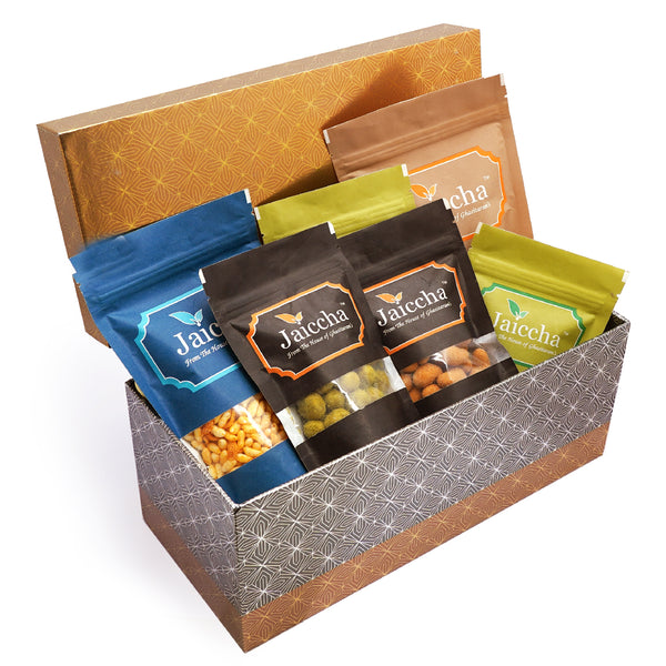 Rectangle box of Badang Bhel, Butter Chakli Sticks, Chocolate Coated Butterscotch, Chocolate Coated Raisins, Crunchy Coated Cashews and Crunchy Coated Peanuts