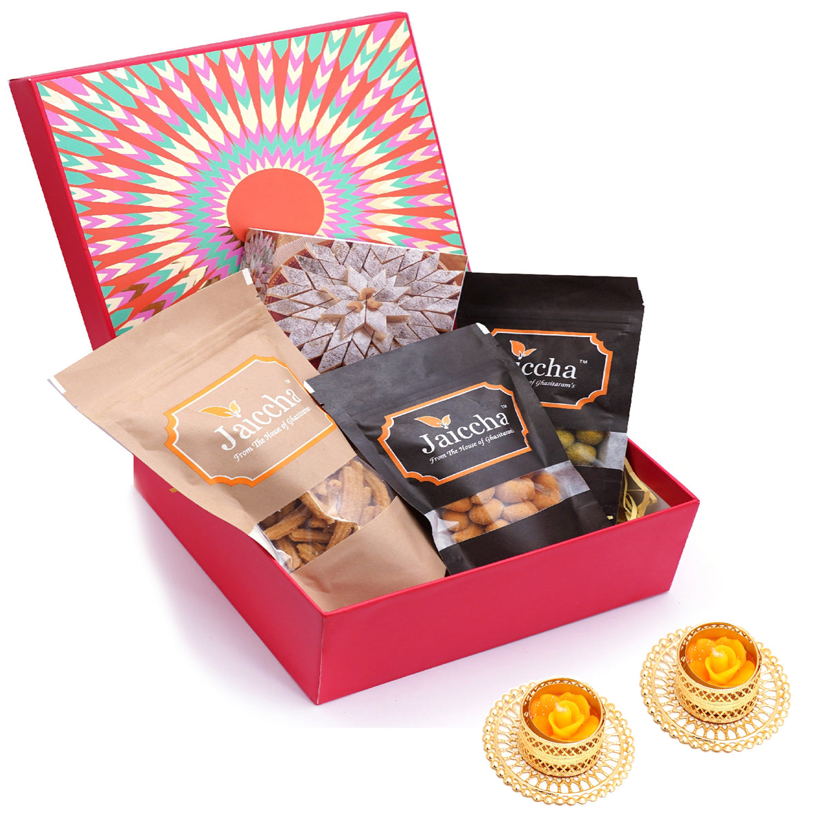 Red hamper box of Kaju Katlis, Crunchy Coated Cashews, Crunchy Coated Peanuts, Butter Chakli Sticks and T-Lites