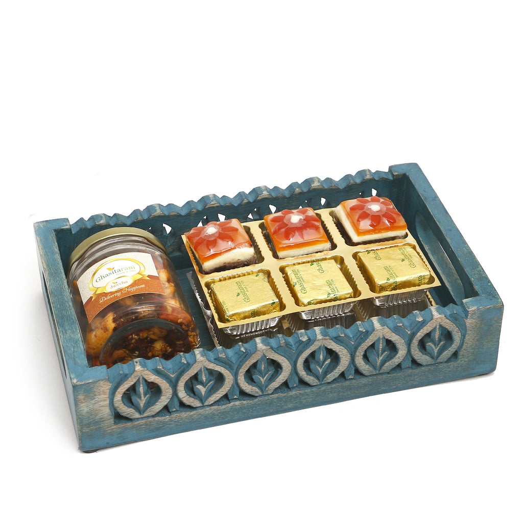 Blue wooden Tray with assorted Bites and Mix Dryfruits Jar