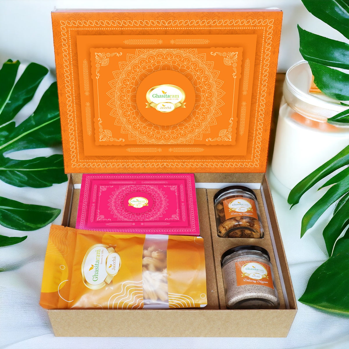 Holi Sweets| Holi Hampers| Holi Gifts Ghasitaram Orange Hamper Box with Gujiyas, Thandai, Bhakarwadi, and Butter Chakli Pouch
