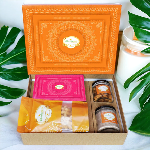 Holi Sweets| Holi Hampers| Holi Gifts Ghasitaram Orange Hamper Box with Gujiyas, Thandai, Bhakarwadi, and Butter Chakli Pouch
