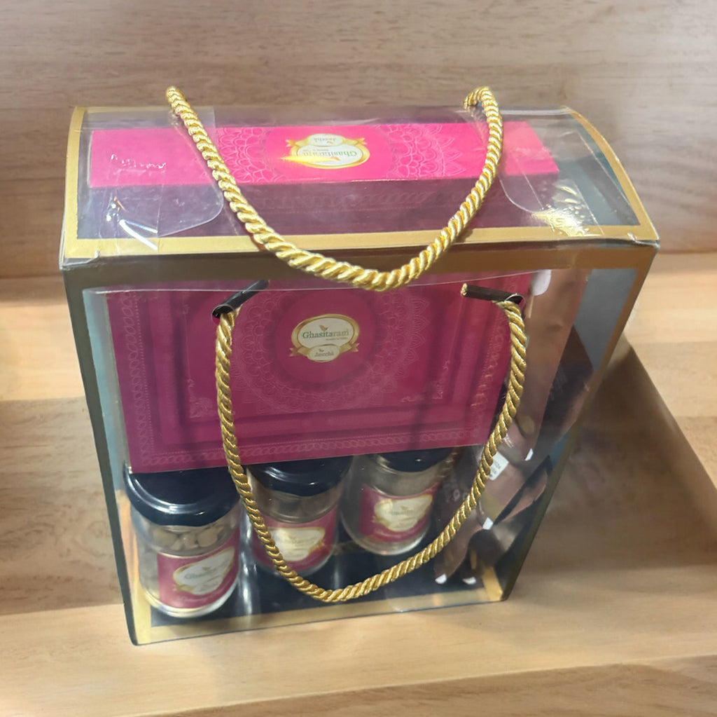 Transparent Holi Gift box with Gujiyas, Thandai, Peanuts, Bhakarwadi and Mewa Bites