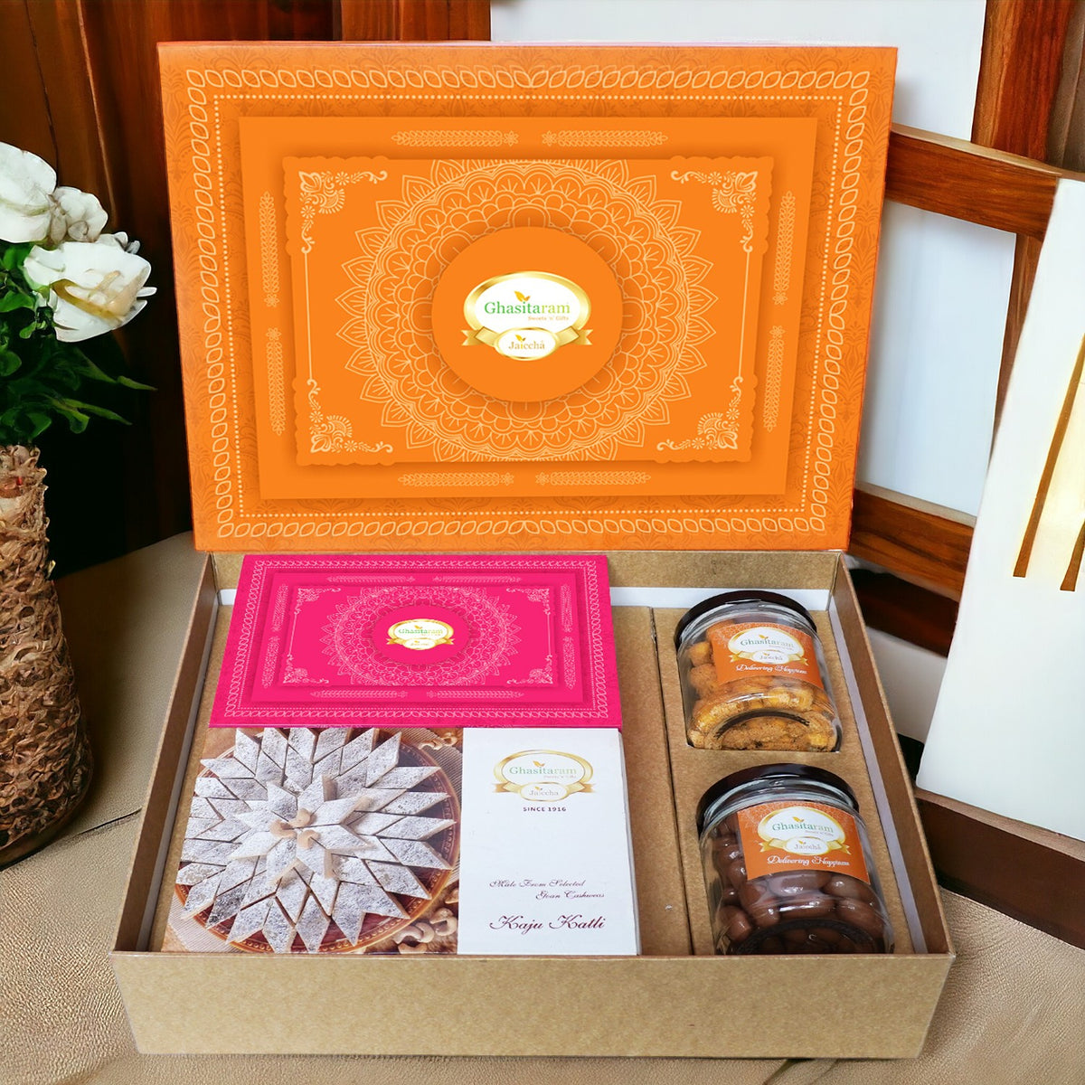 Holi Sweets| Holi Hampers| Holi Gifts Ghasitaram Orange Hamper Box with Kaju Katli, Milk Cake, Choco Coated Almonds and Crunchy Cashews