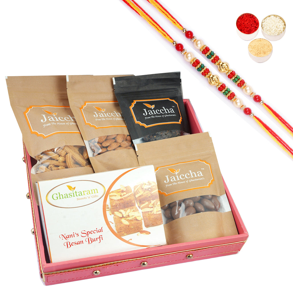 Pink Square tray of Almonds, Butter Chakli, Banarsi Paan, Besan Barfi, Chocolate Almonds With Pearl Beads Rakhi