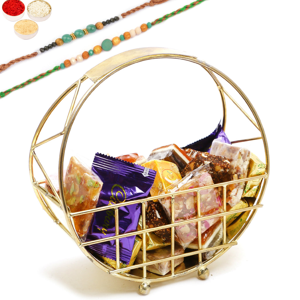 Rakhi Gifts-Half Moon Metal Basket of Bites, Chikki and Cookies With 2 Green Beads Rakhis