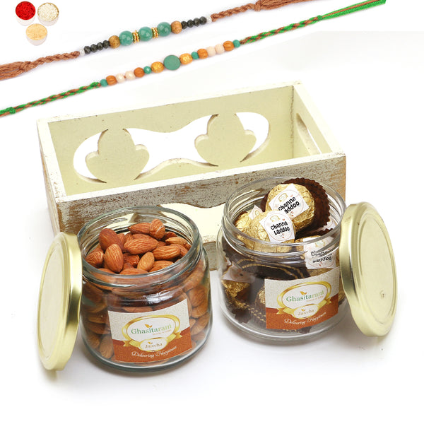 Rakhi Gifts-White Wooden Tray of 2 Jars Of Channa Laddoo and Almonds With 2 Green Beads Rakhis