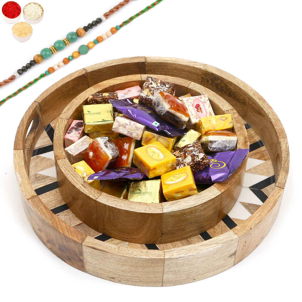Rakhi Gifts-Set of 2 Round Printed Trays of Assorted Bites and Cookies With 2 Green Beads Rakhis